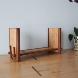 wooden bookshelf with square off bookends